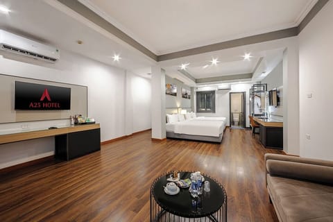 Family Suite Room | Minibar, in-room safe, blackout drapes, iron/ironing board