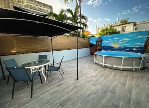 At 10 minutes from beaches and airport but with a cozy retreat in the back patio
