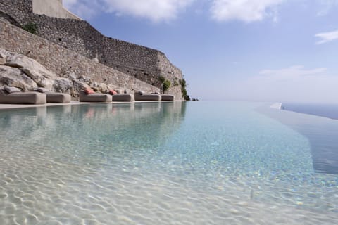 Seasonal outdoor pool, open 10:30 AM to 8:00 PM, pool umbrellas