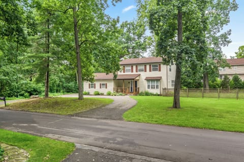 Relax & enjoy this serene colonial, surrounded by mature trees, walking distance to North Commerce Lake