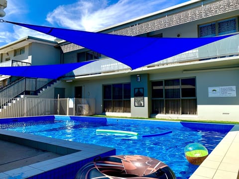 Outdoor pool, open 8:00 AM to 9:00 PM, pool umbrellas, sun loungers
