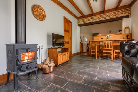 Romantic Armoury Cottage (Your own Private Cottage) | Living area | Flat-screen TV, fireplace