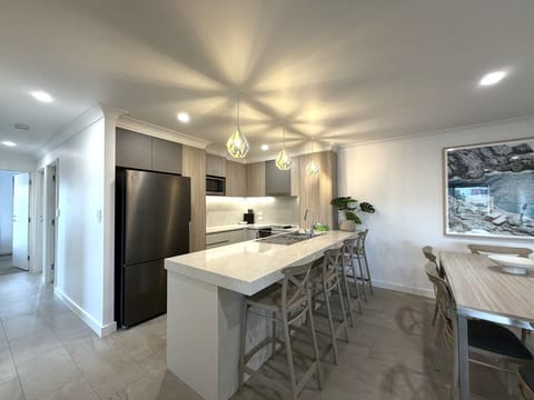 Newly Renovated Three-Bedroom Superior Apartment | Private kitchen | Microwave, electric kettle, toaster, cleaning supplies