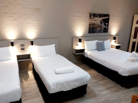 1 Room Queen and 2 singles (Pet Friendly) | Blackout drapes, free WiFi, bed sheets