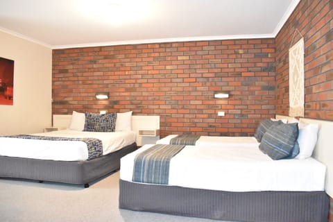 Family Room | Down comforters, free minibar, individually furnished, desk