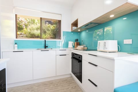 Luxury Suite, 2 Bedrooms, Ocean View, Ground Floor | Private kitchen | Full-size fridge, microwave, stovetop, coffee/tea maker