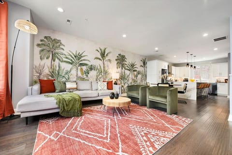 Bright, open-concept living room with stylish decor and comfortable seating