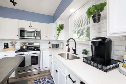 Whip up meals in this modern kitchen  Stainless steel appliances, Keurig coffee station, and tons of natural light make cooking here a joy. Fresh, functional, and fully stocked! ☕