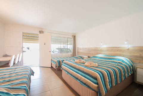Standard Suite, 1 Bedroom, Non Smoking (Quad Room) | Desk, soundproofing, iron/ironing board, cribs (free)