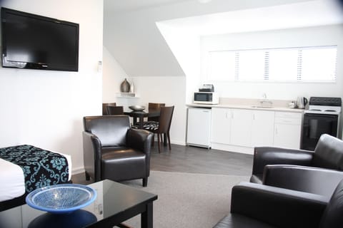 One Bedroom Spa Apartment | Living area | 42-inch plasma TV with digital channels, TV