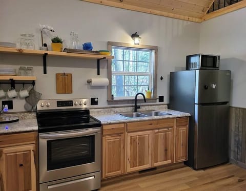 Full-size kitchen appliances provide ample convenience