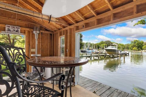 Covered waterfront patio for relaxed outdoor dining