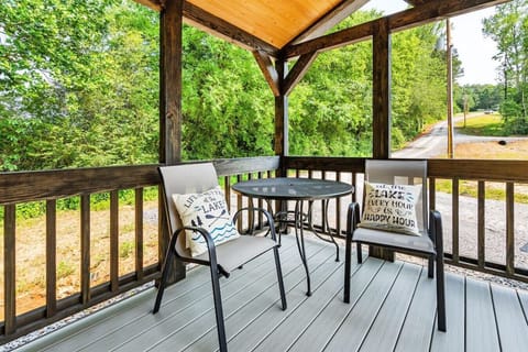 Slow mornings start here — peaceful porch seating surrounded by quiet trees and fresh lake air.