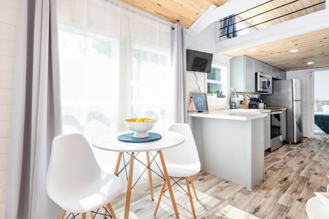 Dining space for two with additional dining on the patio.