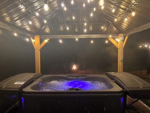 Hot tub under the pergola — perfect for winter evenings
