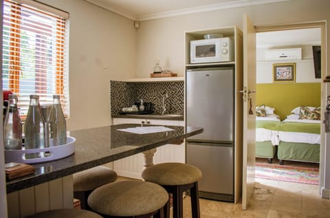 Deluxe Suite, 2 Bedrooms, Patio, Courtyard View | Private kitchen | Electric kettle