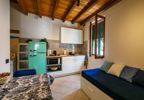 Apartment, 1 Bedroom, Balcony | Private kitchen | Full-size fridge, microwave, stovetop, espresso maker