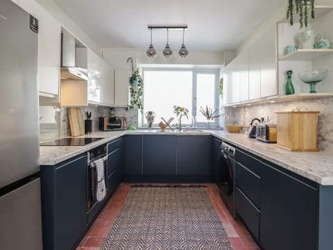 Fridge, electric kettle, toaster, cookware/dishes/utensils