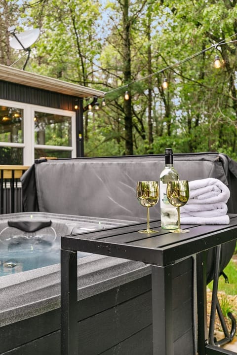 Enjoy a soak in the hot tub with stunning lake views—perfect for relaxation and scenic tranquility.