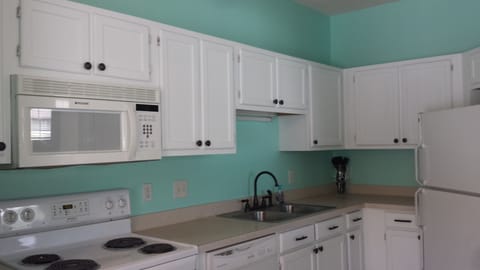 Full size kitchen with all amenities and a pantry.