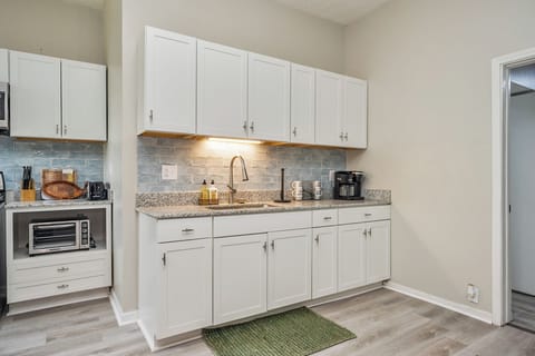 The kitchen is a wide and pleasant open concept, outfitted with all the necessities for your culinary needs.