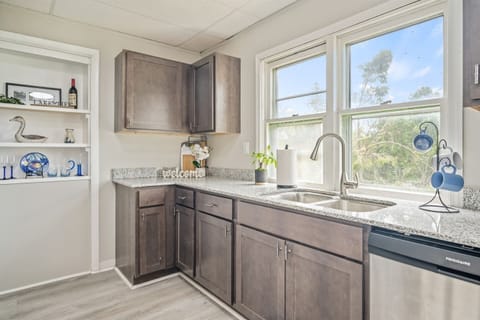 Kitchen sink with big window for natural light and outside view.
