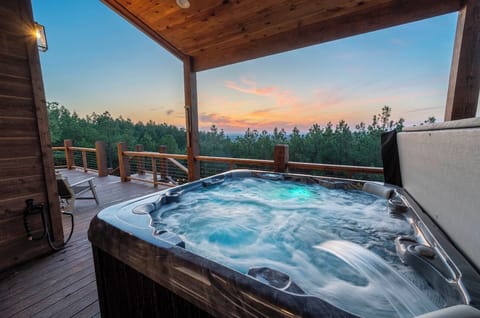 Forest views from the private hot tub — soak, unwind, and take it all in