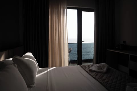 Deluxe Double Room, Balcony, Sea View | In-room safe, desk, blackout drapes, iron/ironing board
