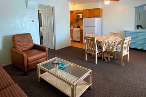 Deluxe Apartment, 2 Double Beds, Courtyard Area | Living area | 42-inch TV with cable channels