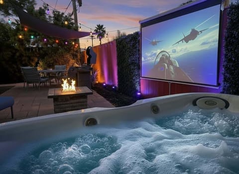 Private hot tub cinema with fire bowls and big screen in a North Park San Diego Airbnb backyard retreat