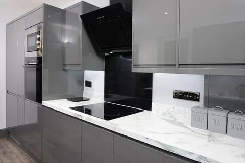 Essential appliances with white marble countertop to added touch of sophistication. 