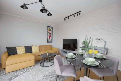 The bright, cosy living room interior is harmoniously combined with the dining area.