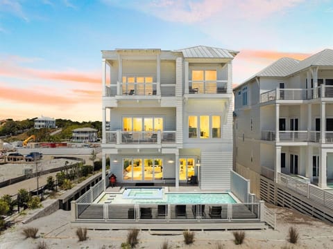 This expansive 8-bedroom home features a private heated pool, spa, and elevator.