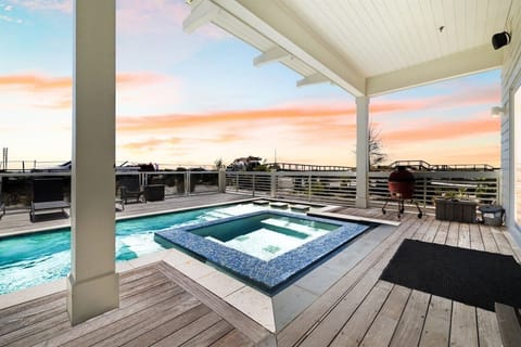 After a day at the beach, enjoy the sunset from your private pool and spa.