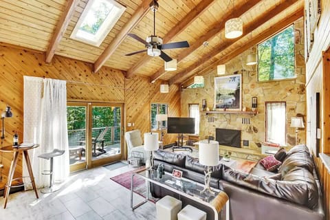 Spacious open concept living room with cathedral ceilings.
