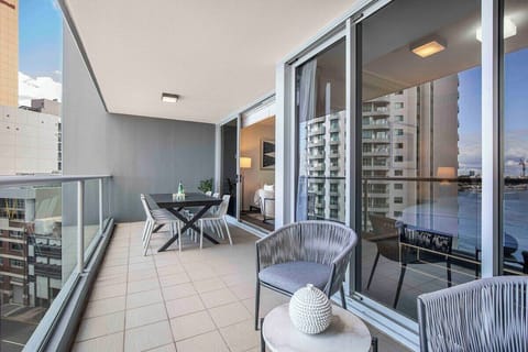 Alfresco dining with river and city views.
