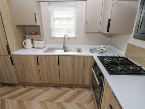 Fridge, electric kettle, cookware/dishes/utensils