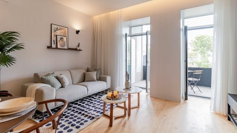 Inviting living area with a dining table, comfortable couch, TV, access to the balcony, and an abundance of natural light, creating a bright and welcoming space for relaxation and entertainment.
#relax #comfort