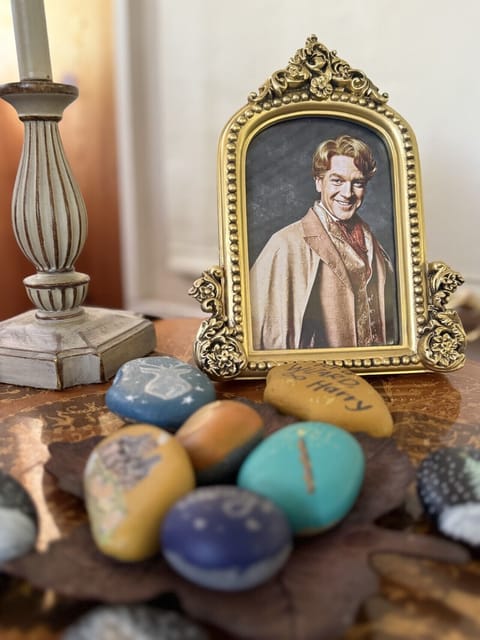 We love Professor Lockhart and handpainted rocks are for sale inside Wizards Burrow!