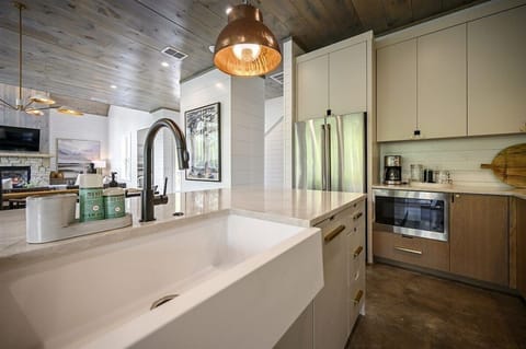 Kitchen Oasis: Sleek countertops, modern appliances, and stylish lighting for culinary adventures!