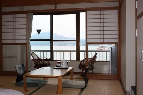 Economy Room, Non Smoking, Partial Sea View | Down comforters, desk, free WiFi, bed sheets