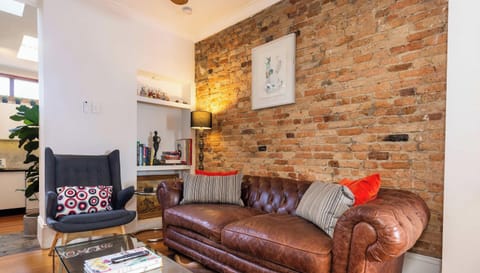 Chesterfield leather lounge and occasional chair in lounge area