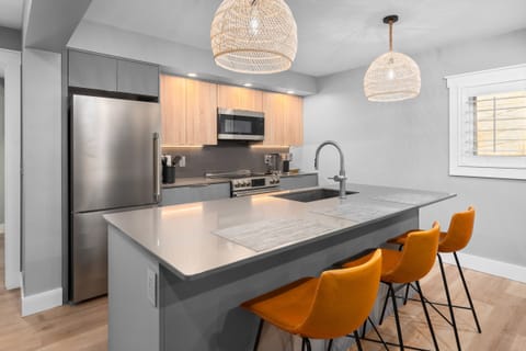 Comfortable island seating. Large refrigerator/freezer.