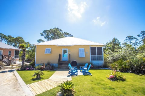 Front of Cottage, parking to the Left of wood sidewalk