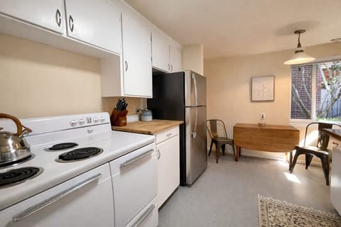 Fully equipped modern kitchen with full-size appliances, ample counter space, and everything you need to cook at home.
