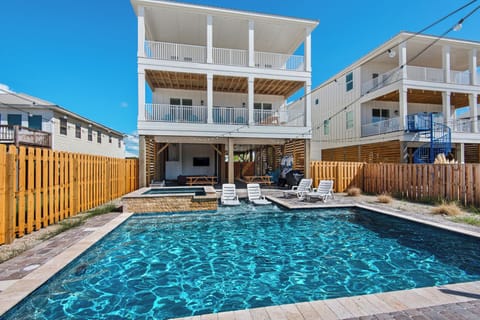 Private resort-style pool with spacious beach house views