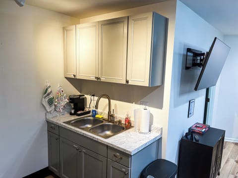 Start your mornings right with our complimentary selection of coffee and There's a coffee maker and a kettle available for your use. We've stocked the kitchen with a comprehensive set of cookware, including pots, pans, baking trays, and various cooking utensils. You'll find everything you need to whip up a feast.