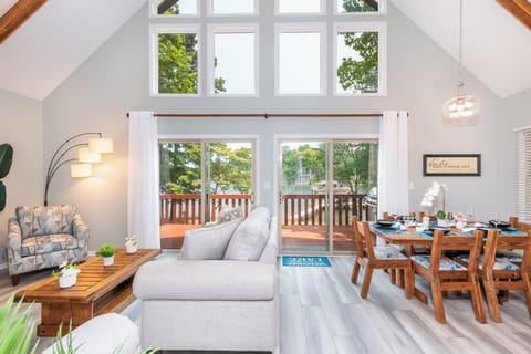 Wall of windows with lake views — bright, open living space