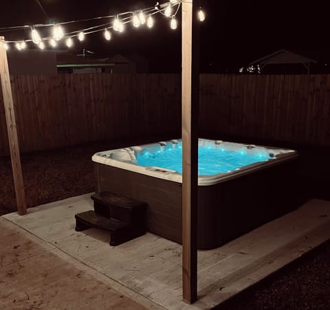 Completely private, 7 person Hot Tub in fully fenced backyard next to fireplace.
