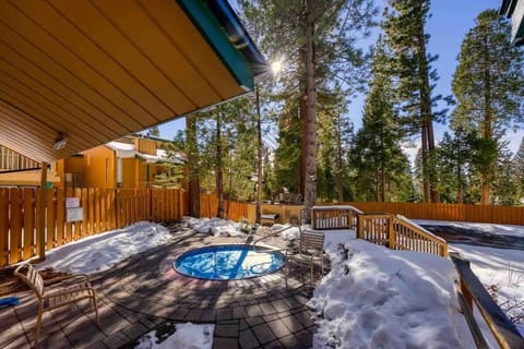 Deck with a hot tub — a great place to relax and enjoy the fresh mountain air.
